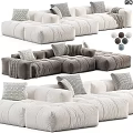 Cozy Modern Sectional Sofa In Neutral Tones With Decorative Pillows And Throw Blankets