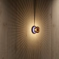 Elegant Modern Wall Lamp on Wooden Wall with Radiant Warm Light Effect