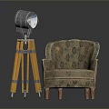 Classic Patterned Fabric Armchair With Wooden Legs Beside Yellow Tripod Floor Lamp