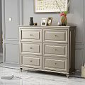 Elegant Modern Chest of Drawers with Gold Handles and Decorative Items in Grey Wall Interior
