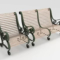 Green Outdoor Benches With Wooden Slats Metal Frames Ornate Scroll Details And Wheels