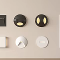 Modern Wall Lamps With Various Black And White Designs Mounted On Beige Wall