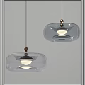 Modern Transparent Glass Pendant Lights With Metal Details And Illuminated Design