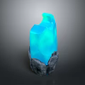 Glowing Blue Crystal Decorative Piece With Natural Stone Base And Textured Details