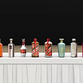Colorful Wine Bottles And Wine Glasses Arranged On White Shelves With Black Background