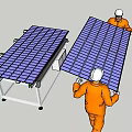 Workers In Orange Workwear And White Helmets Installing Solar Panels