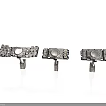 Three Metal Mechanical Components With Circular Centers And Mounting Rods