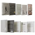 Variety of Books and Magazines with Different Colored Covers Arranged and Stacked on Shelf