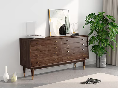 Modern Wooden Chest of Drawers with Golden Handles and Decorative Painting Near Green Plant 3d model
