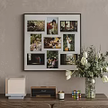 Stylish Photo Wall With Family Lifestyle Photos And White Tulip Vase On Wooden Table