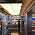 Modern Enterprise Exhibition Hall With Display Counters Digital Screens And Visitors