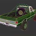 Green Pickup Truck With Spare Tire On Truck Bed And Roof Rack