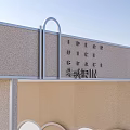 Hennessy Exhibition Pavilion Modern Architectural Design With Arched Doorways And Light Colored Facade