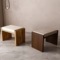 Two Minimalist Wooden Stools With Soft Upholstered Seats In Light And Dark Wood Tones
