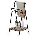 Black Metal Towel Stand with Wooden Shelf Bath Towels Soap Bottles and Dried Plant Vase