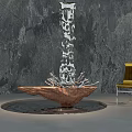 Intricate Metal Sculpture Carving With Tall Hollow Design And Brown Base Near Yellow Chair
