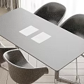 Black Conference Table with Black Chairs and Two White Papers on Top