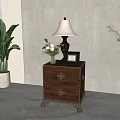 Classic Wooden Nightstand with Table Lamp Photo Frame and Flower Vase in Cozy Bedroom Interior