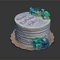 Birthday Cake with White Frosting Pink Happy Birthday Text Green Blue Flowers on Golden Tray