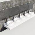 Five white sinks with silver faucets on long white countertop against gray concrete wall