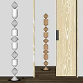 Indoor Columnar Sculptures Featuring Silver Metal And Wooden Carvings With Diamond Shaped Cylindrical Stacked Design