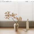 Golden Leaves Branch In Textured Vase With White Sculptural Bottle On Wooden Floor