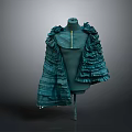 Green Ruffled Cape Design On Mannequin With Elegant Fashion Details