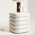 Modern Gray And White Stacked Nightstands With Table Lamp Vase Flowers Books And Small Bowl
