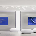 Modern Style Showroom With Curved Screens Central Column White Circular Seats And Geometric Ceiling