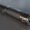 Black Metal Flashlight With Textured Grip And LED Bulb Design