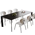 Black And White Dining Table With Chairs In Dining Room With Fruit And Bottle