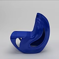 Blue Modern Single Chair with Sleek Curved Design and Smooth Shiny Surface