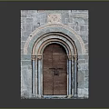 Arched Wooden Door With Carved Details In Stone Wall Frame And Columns