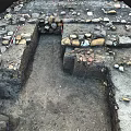 Archaeological Excavation Site With Ancient Stone Remains And Dirt Path