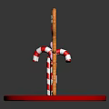 Three Gingerbread Men Figurines Holding Candy Canes On Red Bases Against Black Background