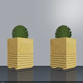 Yellow Wooden Square Planters Holding Green Spherical Potted Plants With Striped Design And Wheels Indoor Decor
