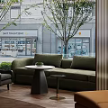 Hotel Public Lounge Area with Large Windows Overlooking Trees and Street Scenes Modern Curved Design