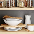White Kitchenware Arranged On Wooden Shelves With Jars Bowls Plates And Spoons