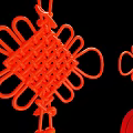 Red Chinese Lanterns With Hanging Knots And Multi Layered Designs On Black Background