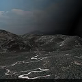 Breathtaking Mountain Range With Winding River And Green Vegetation Under Blue Sky