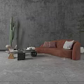 Modern Living Room With Orange Sectional Sofa Throw Pillows Coffee Table And Green Plants