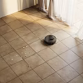 Tile Flooring With Robot Vacuum Cleaning Debris
