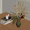 Dried Flowers in Green Vase on Wooden Table with Books and White Bird Figurines
