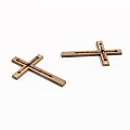 Two Handcrafted Wooden Crosses with Carved Slots on White Surface
