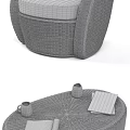Rattan Outdoor Sofa with White Cushions and Round Coffee Table in Cozy Setting