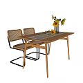 Modern Wooden Dining Table Set With Rattan Back Chairs Black Metal Frames And Sunflower Vase