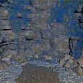 Natural Rock Wall With Lush Green Plants And Stone Ground