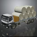 White Flatbed Truck Carrying Multiple Large Paper Rolls On Cargo Bed