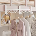 Cozy Modern Bedroom Clothes Rack With Hanging Clothes Headphones Handbag And Stuffed Toy
