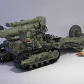 Military Artillery Weapon with Tracked Chassis and Cannon Barrel and Ammunition Shells